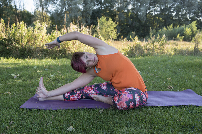 Woman practicing yoga at Kalm n Kind Yoga