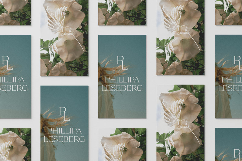 A grid of book covers designed by Sweet Pea Ink Creative, featuring a woman in a brown dress facing the ocean and covers with the initials "PL" over blue and white rock formations, showcases thoughtful brand design.