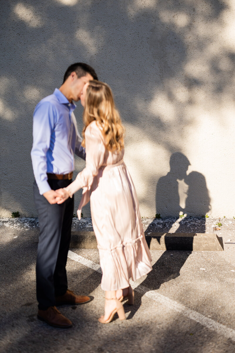Couple kissing during engagement photos in Birmingham