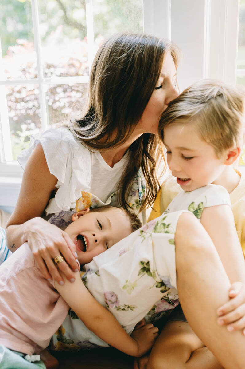 mom kissing her son