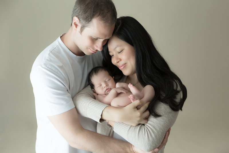 Grey Loft Studio - Bethany and Luc Barette - Wedding Photography Wedding Videography Ottawa - Asian and Caucasian couple holding baby newborn photography
