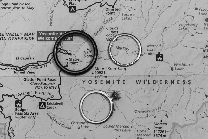 Wedding bands placed on a map of Yosemite National park
