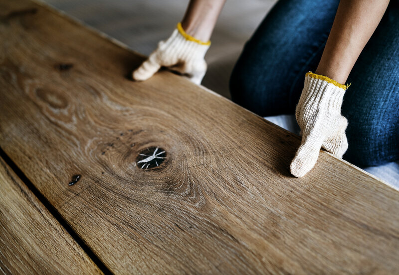 carpenter-man-installing-wooden-floor-2022-12-16-00-42-51-utc