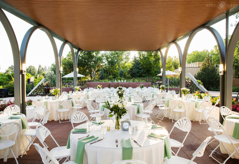 Dinner wedding reception set up under the Annuals Garden Pavilion at Denver Botanic Gardens