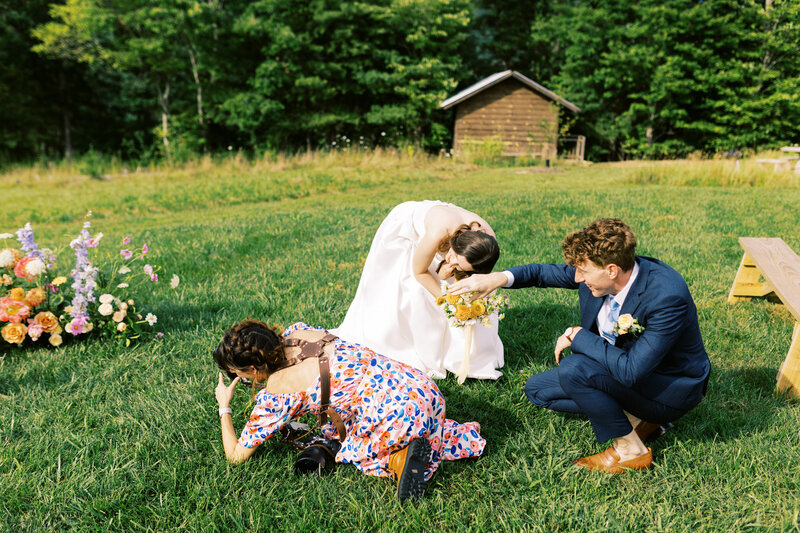 The bride and groom try to get their puppy's attention behind Megan Lynn of My Sun and Stars Co.