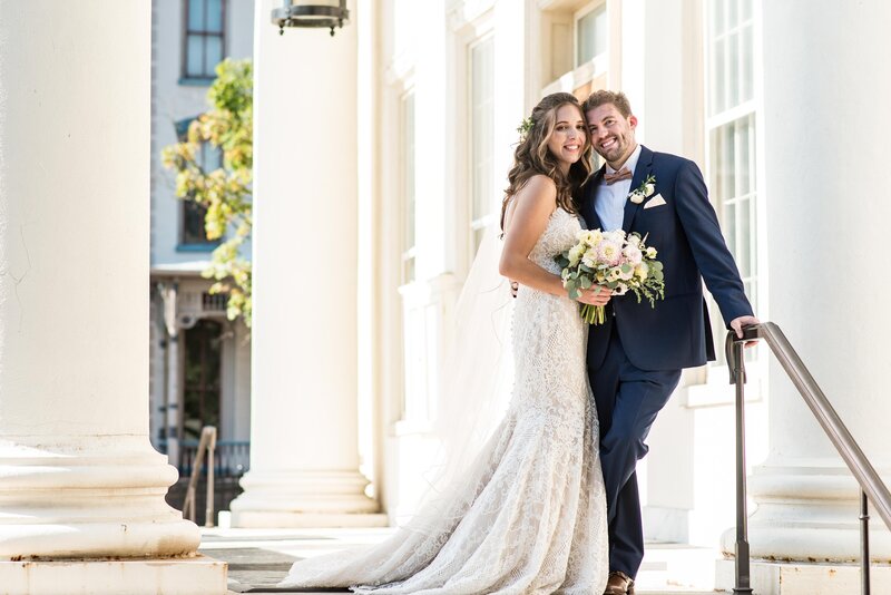 Bride and groom look at the camera, smiling on their wedding in Austin