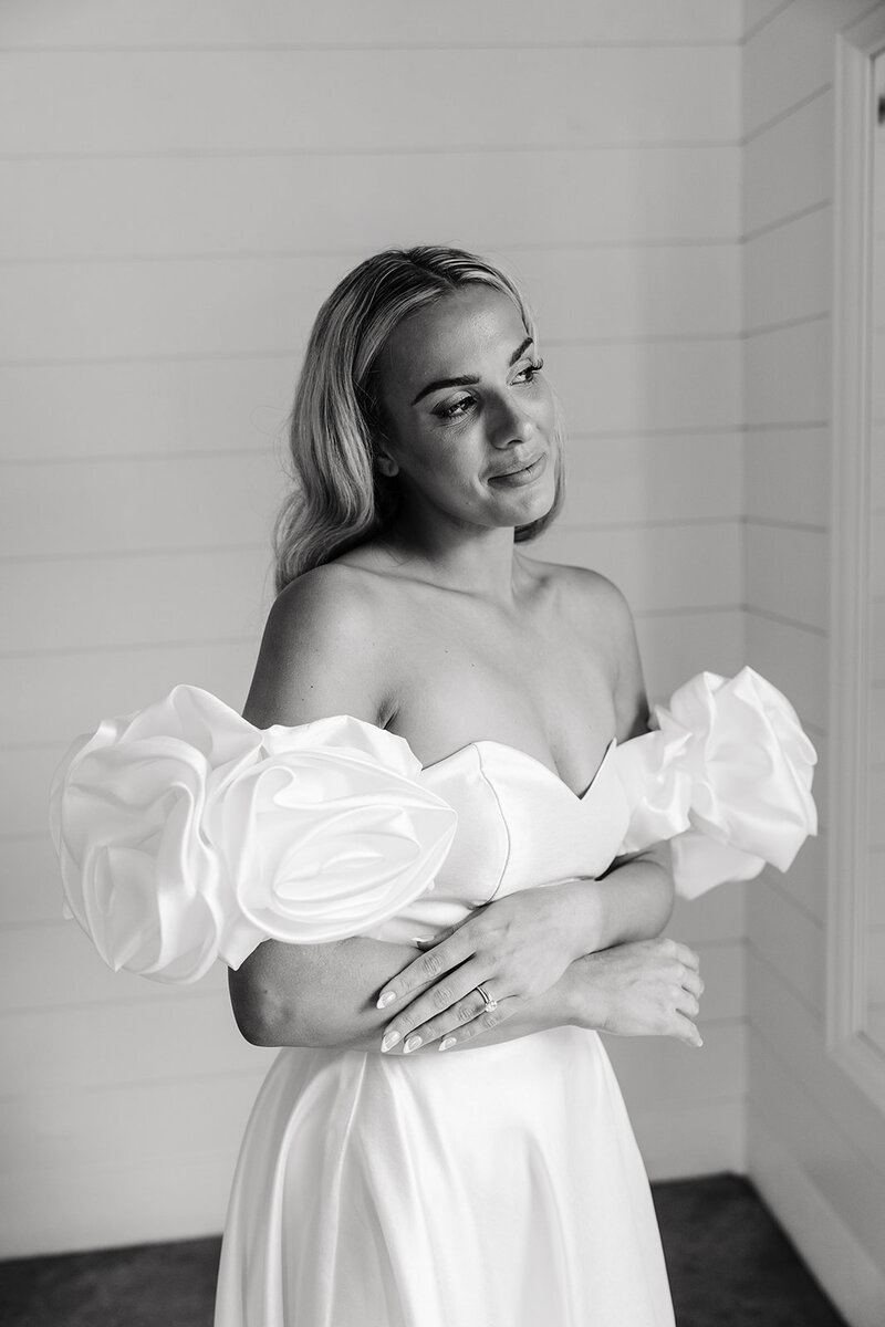 Bride looking out the window with elegance 