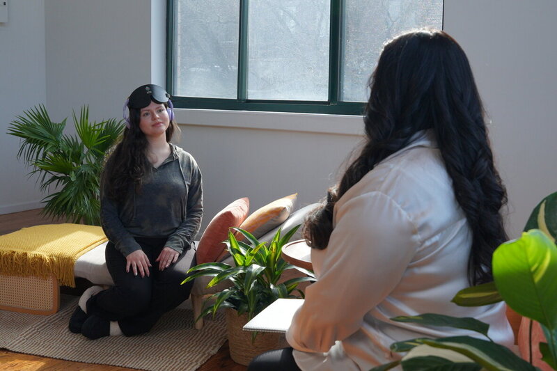 Therapist and client sitting in conversation during a counseling session representing Rooted Renewal therapy for emotional support before and after bariatric surgery at Rooted & Nourished Psychotherapy