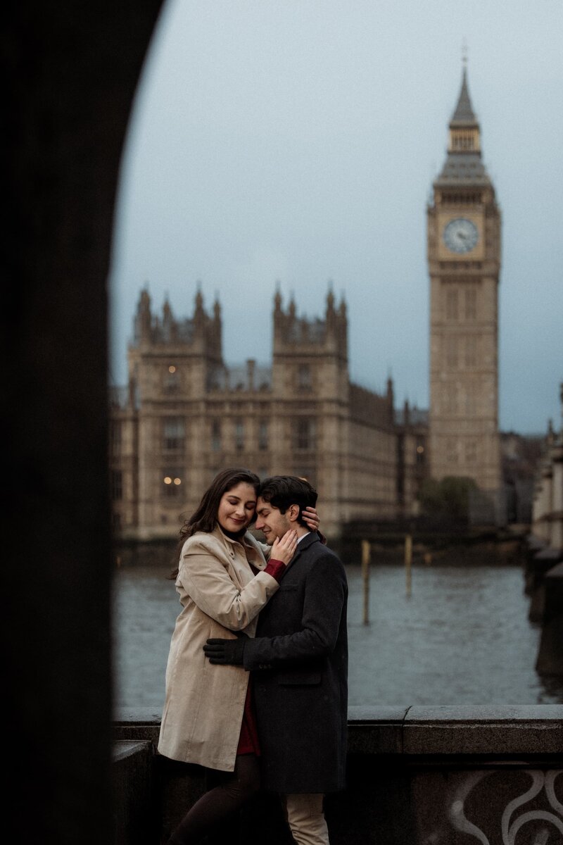 Romantic couple embracing during winter  engagement portrait photography at BigBen in London