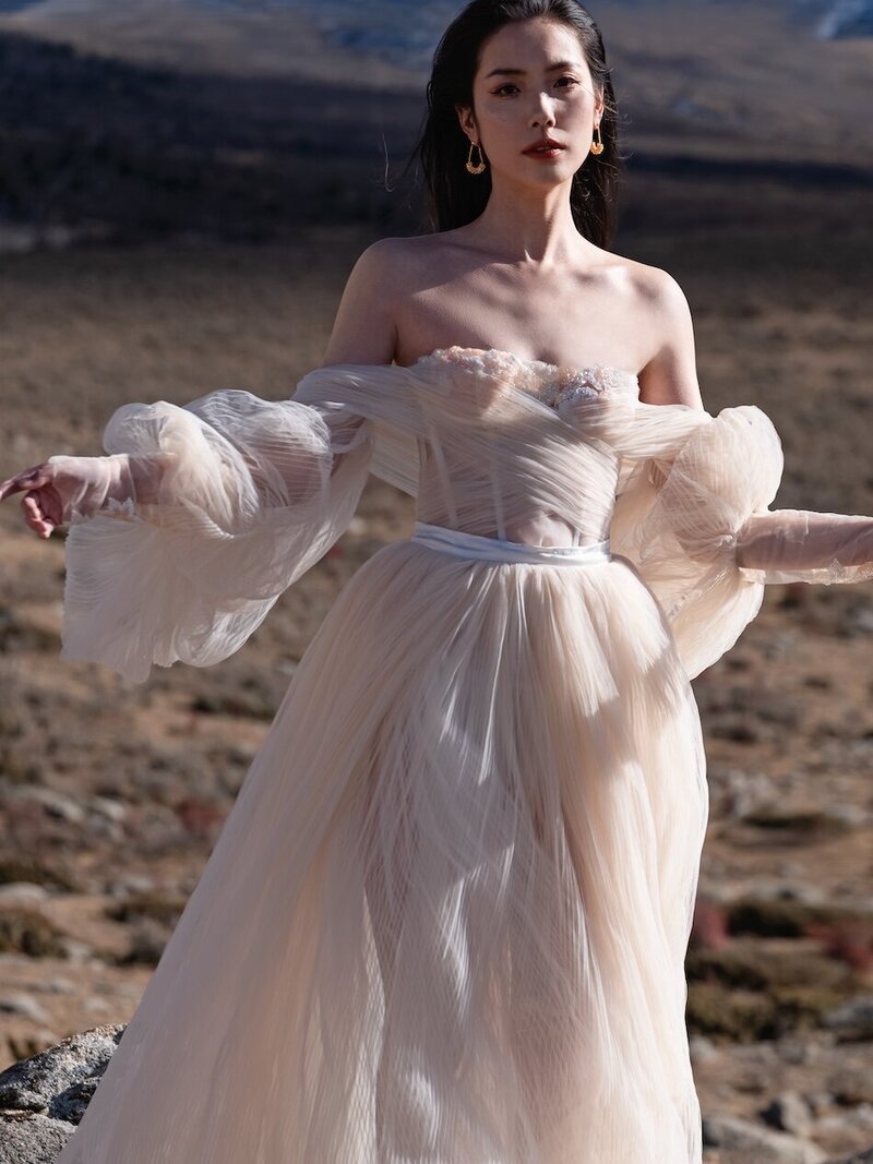 Couture bride shot in dramatic mountain scape.