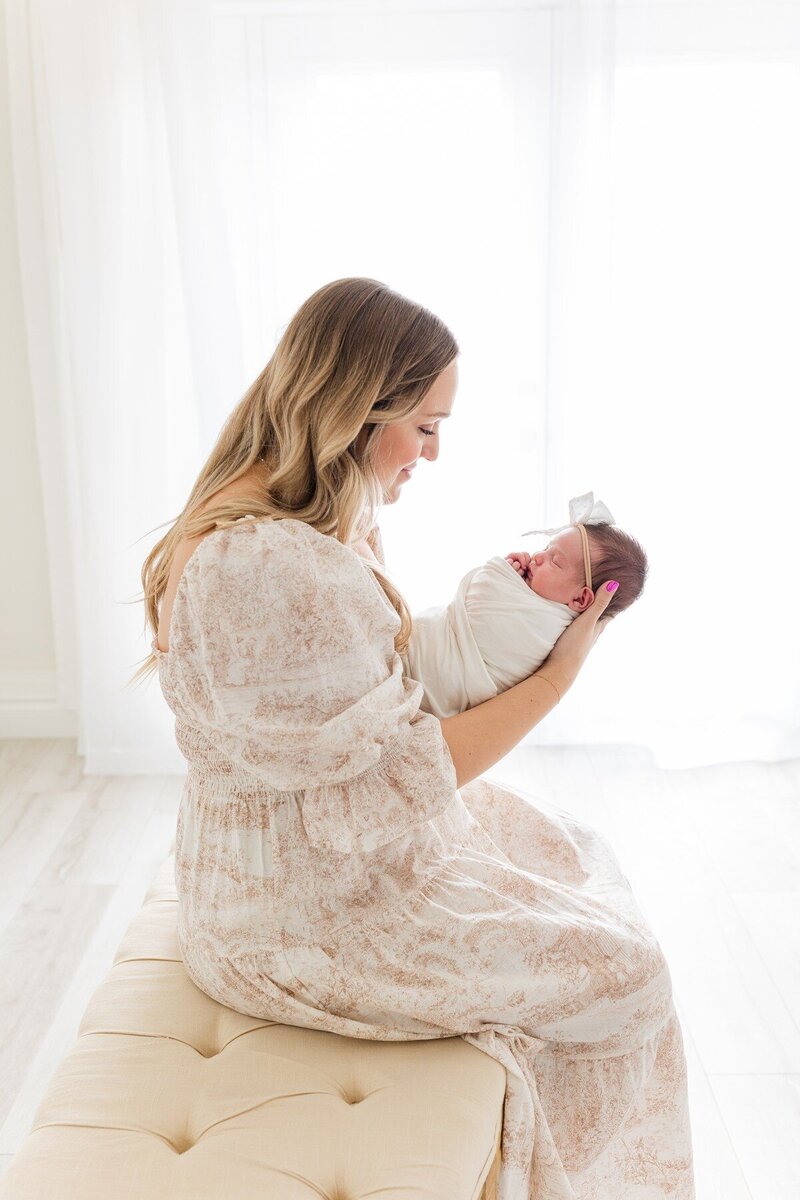 oklahoma-city-newborn-photography-mom-holding-baby-girl-studio-28