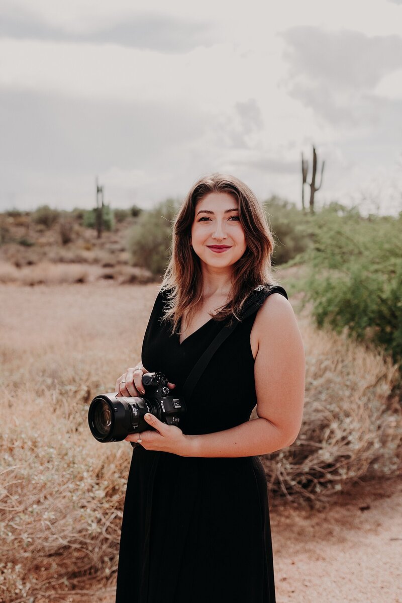 Suzy Goodrick's Associate photographer stands in the desert for a headshot
