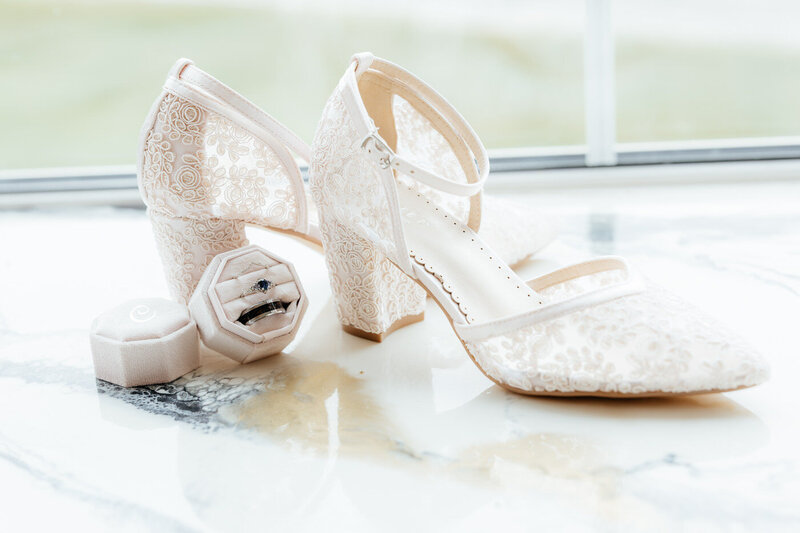 Bride's shoes and the couple's wedding rings. 