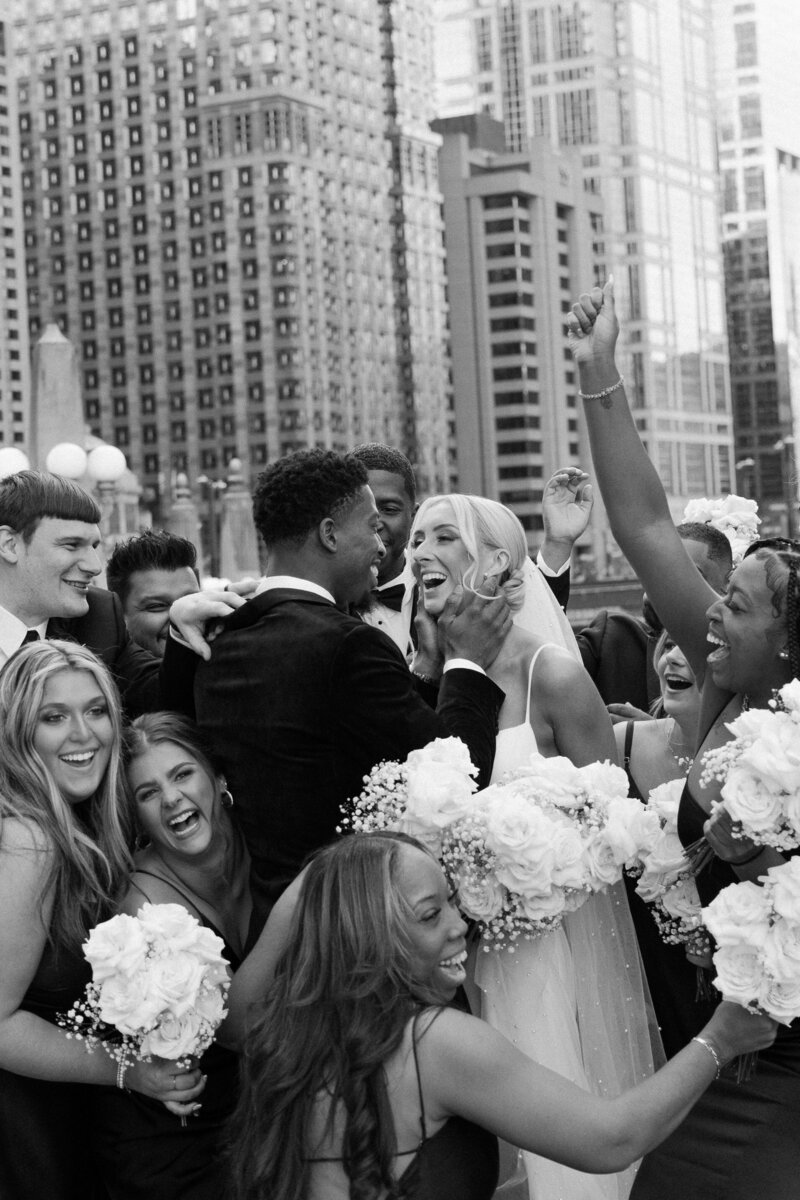 Bride and groom joyfully celebrating their wedding day, captured by a Wisconsin wedding photographer.