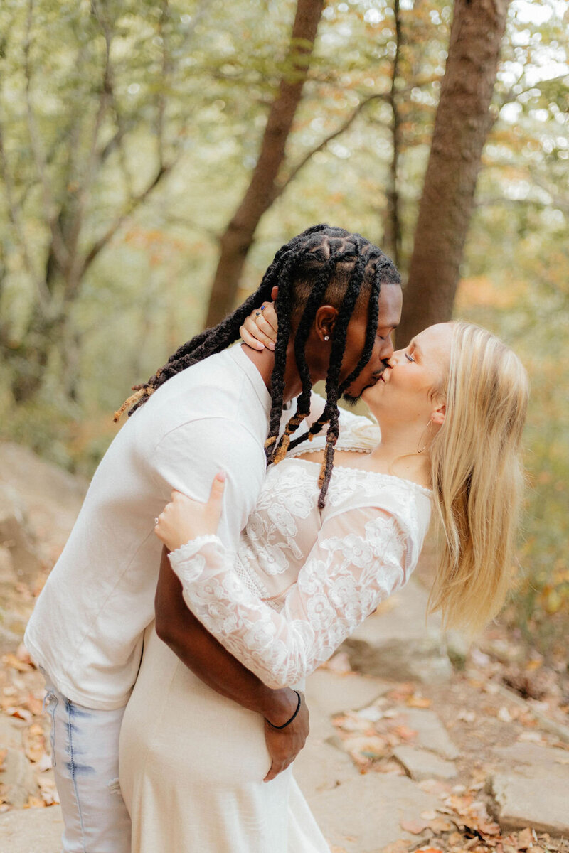 couple kissing in trees