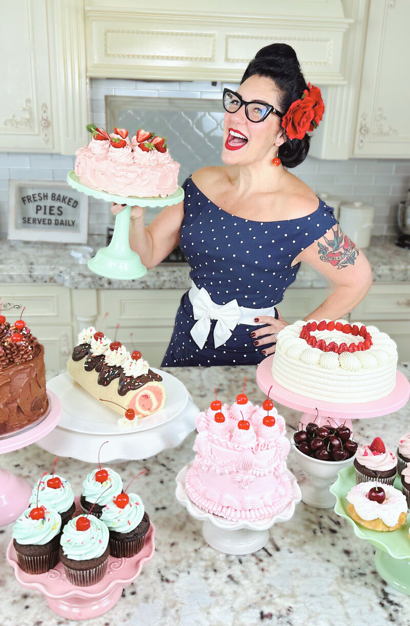 Dyana holding one of her cakes