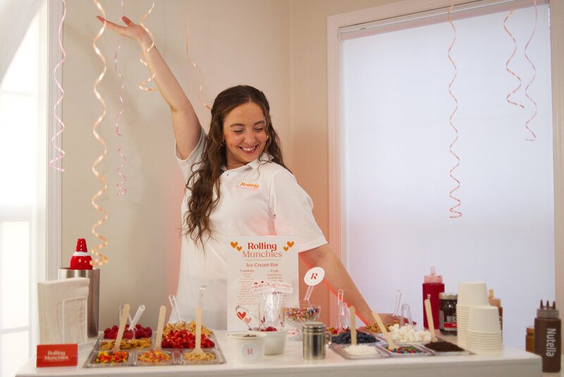Owner Allie smiling with snack cart at event