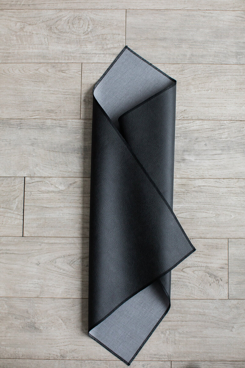 Protective cover mat placed over styling surface to prevent damage
