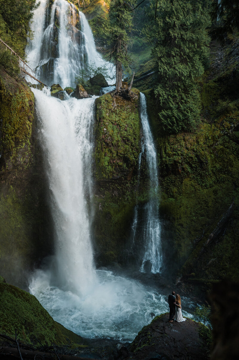 Couple eloping at Falls Creek Falls waterfall in Washington State