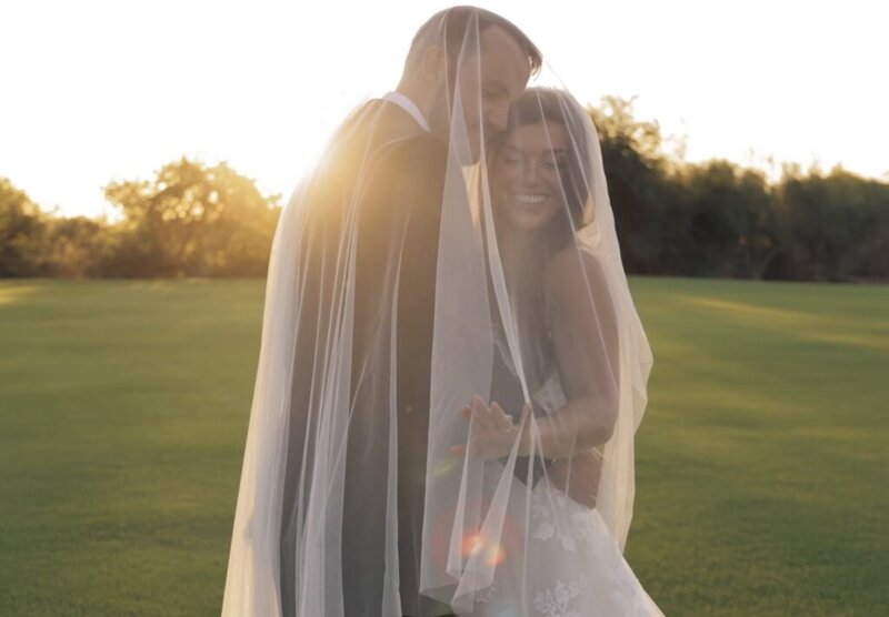 still of arizona wedding video bride and groom laughing at venue