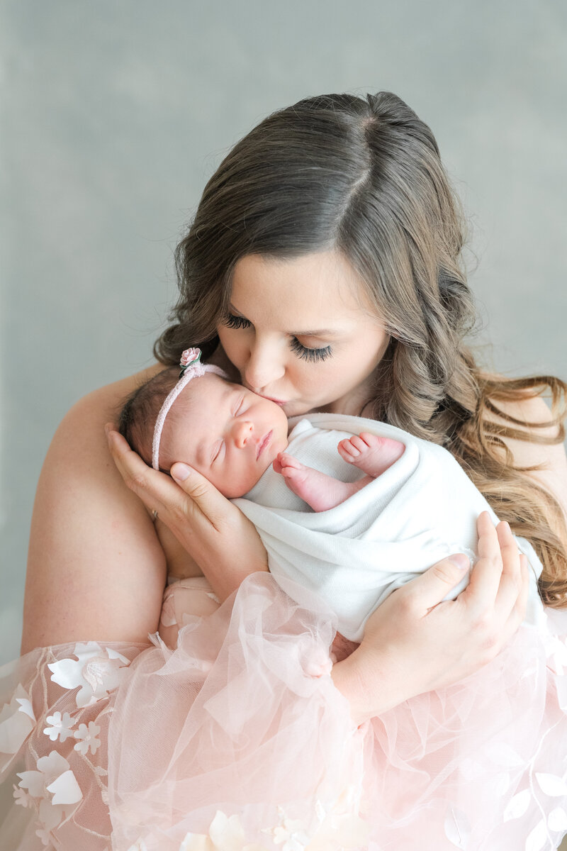 In-studio Maternity Session with floor floral arrangments for mother's day minis photoshoot