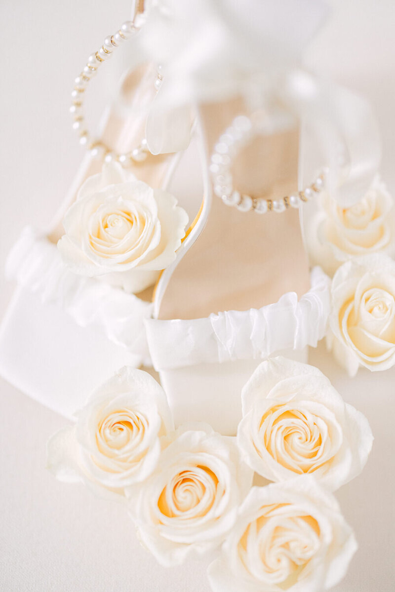 Photograph of a bride's wedding day essentials as she prepares at her venue, capturing the elegant and intimate details