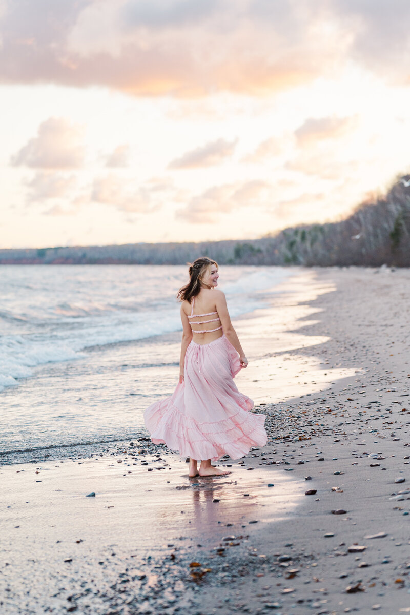 senior on beach during senior photoshoot