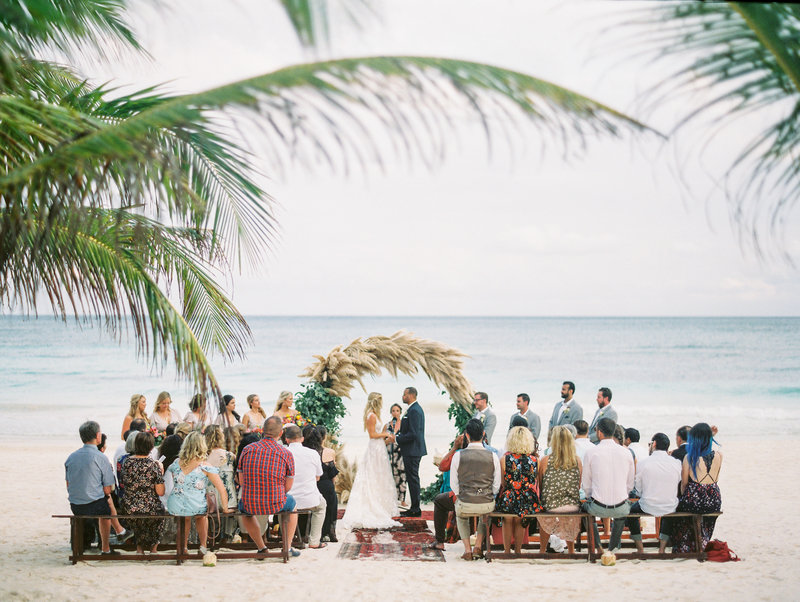 A beachside wedding ceremony at Akiin Beach Club in Tulum Mexico with Fresa Weddings