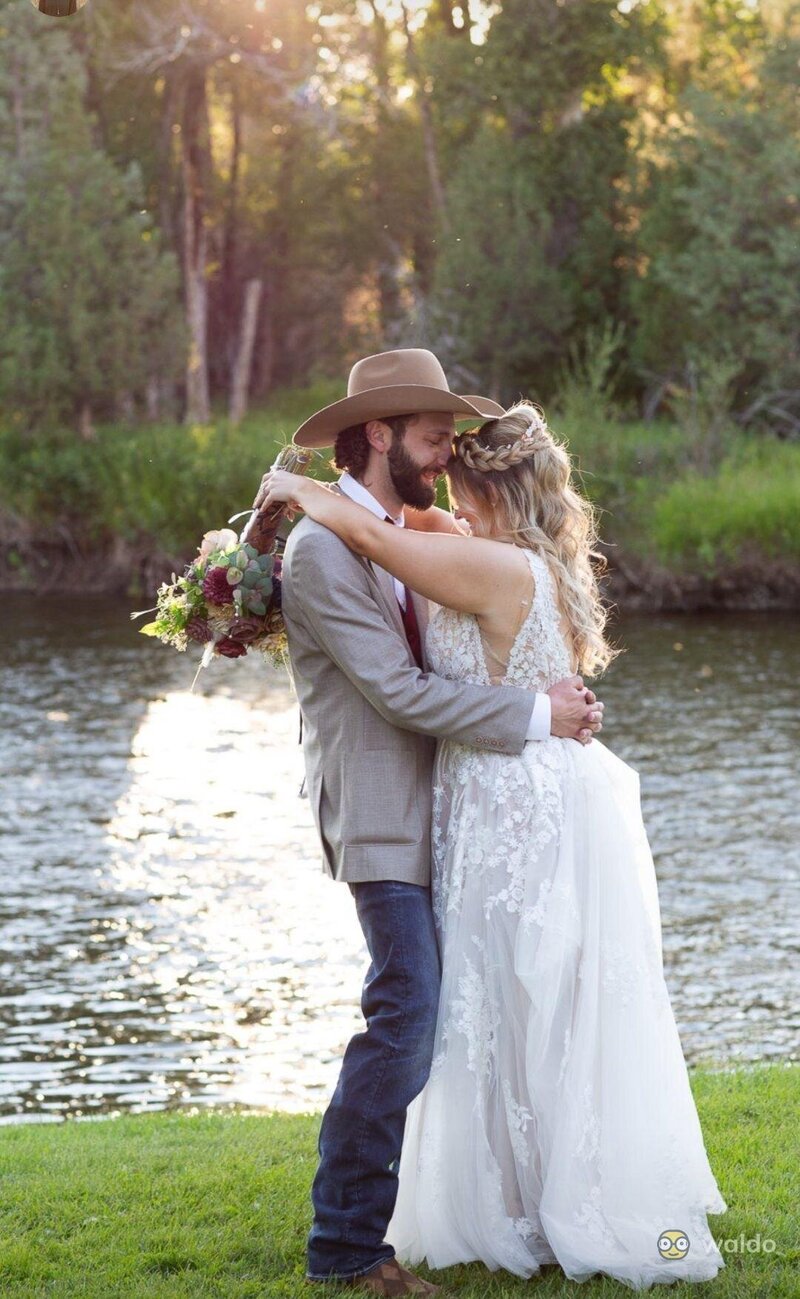 Wedding couple by river at Elk Hollow