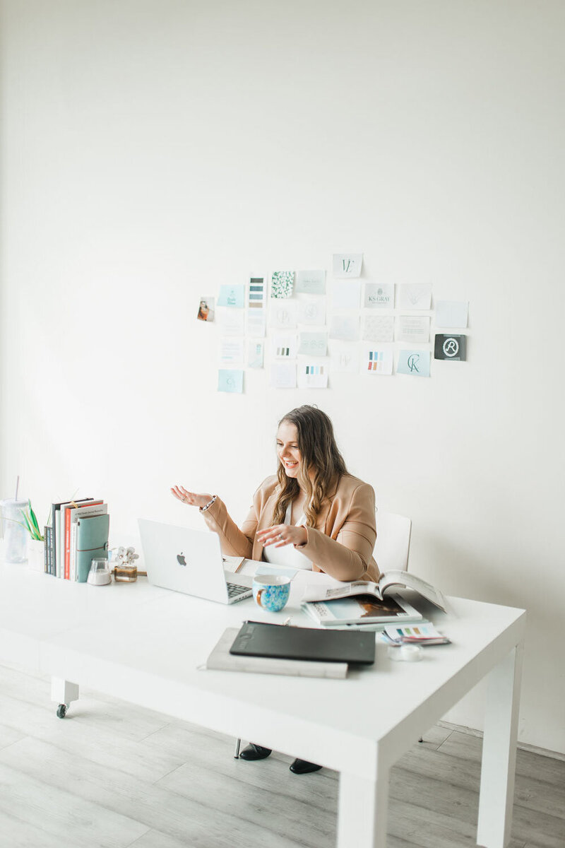 Graphic designer looking through book