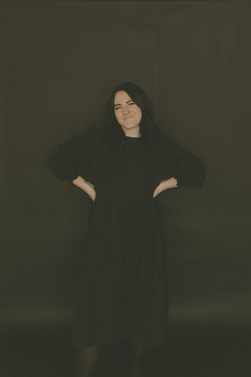 girl smiling with her hands on her hips