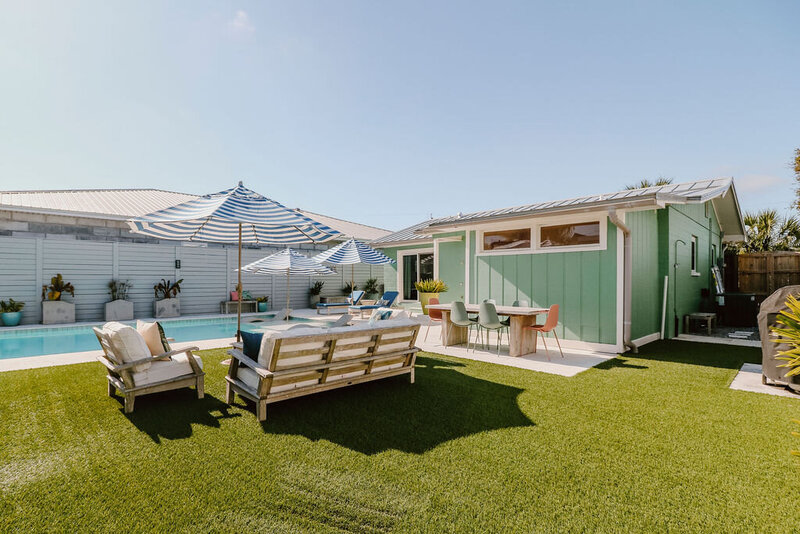 outdoor sitting area with couch and chairs