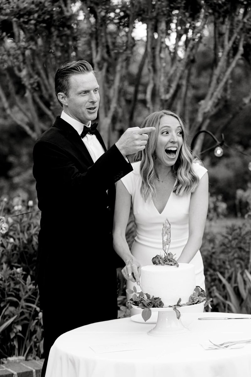 Groom pointing and bride laughing at Clifton Inn Charlottesville wedding
