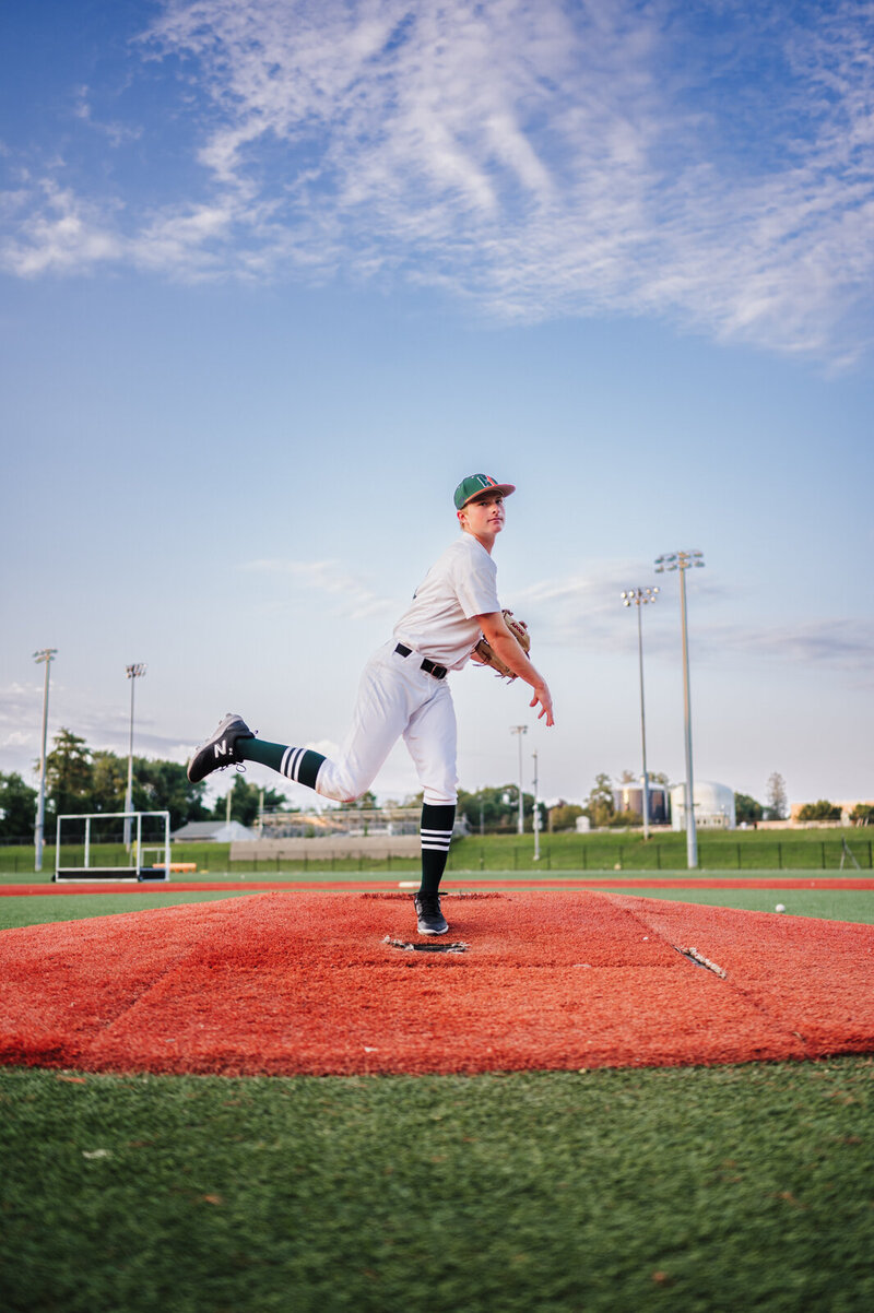 baseball player on a mound throwing a baseball