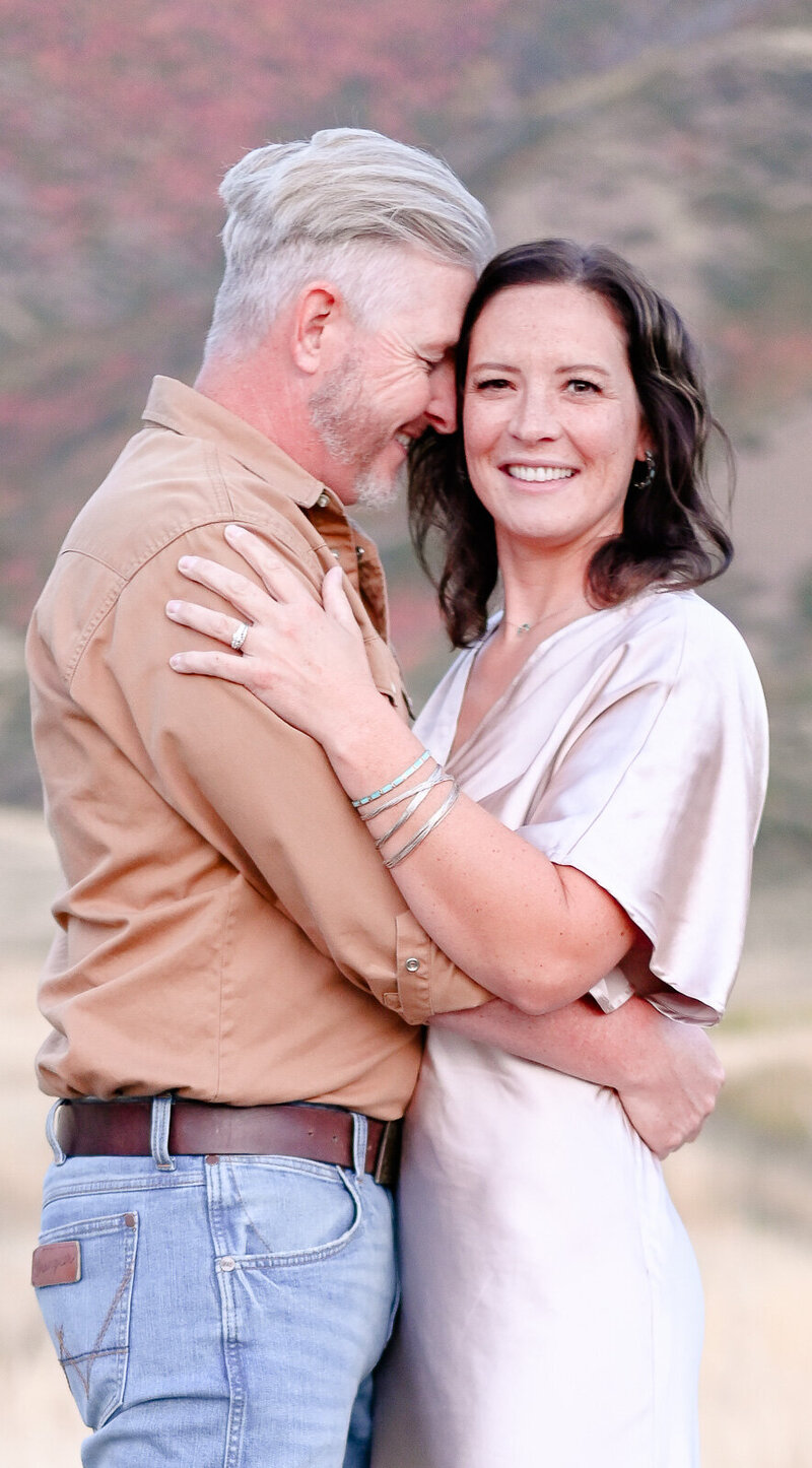 Couple embracing in the golden hour light in Mapleton, Utah