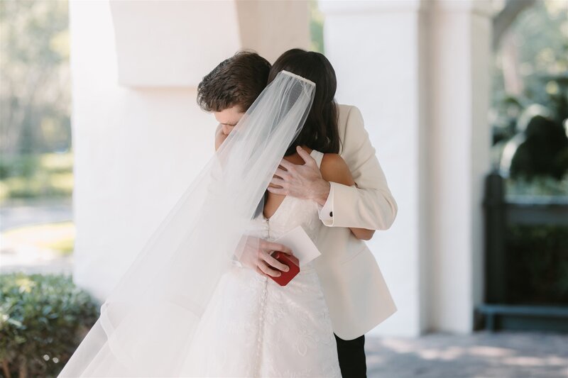 bride and groom embrace after first look