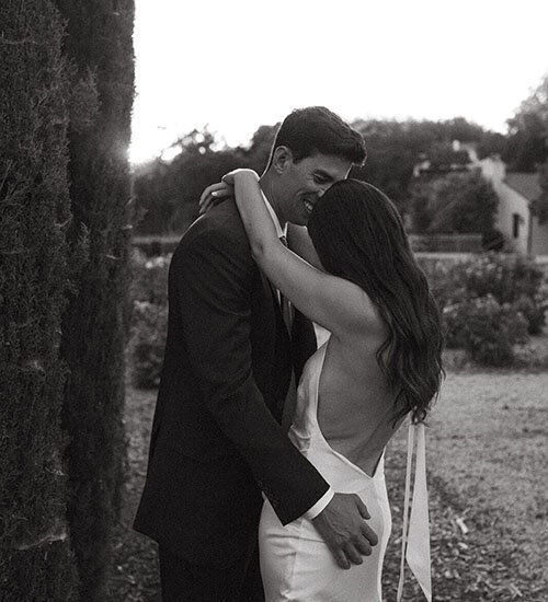 A bride and groom embrace on their wedding day in Napa, CA.