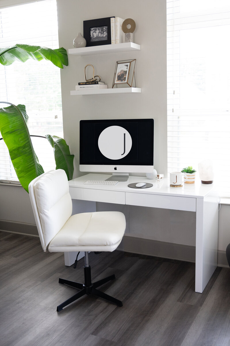 computer on desk with Jane Osler Creative logo