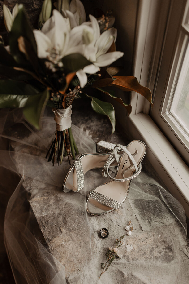 detail shots of brides shoes and bouquet