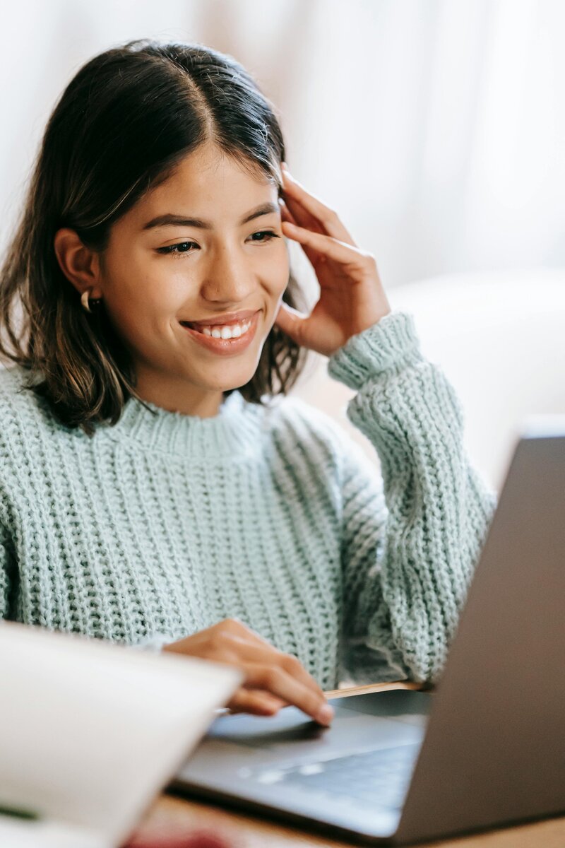 woman on computer smiling