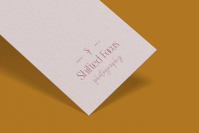 Logo for Shifted Focus Photography on the bottom of a paper