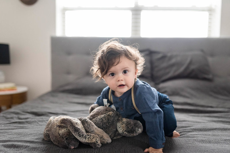boy with his bunny on the bed