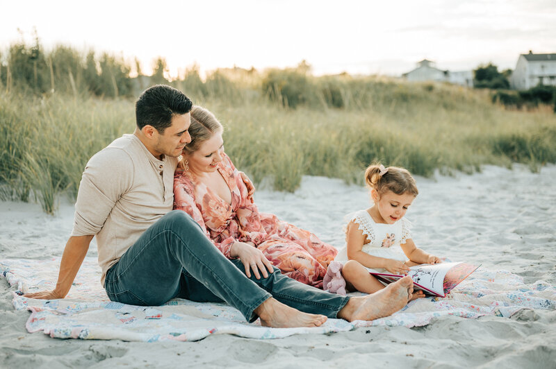 two sisters on bed with baby brother