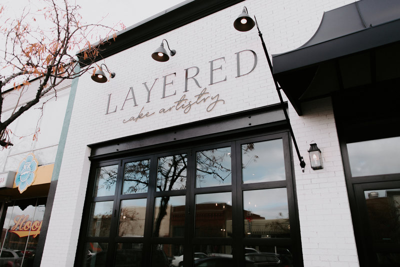 The white brick and window exterior of our brick and morter bakery located in Downtown Kennewick