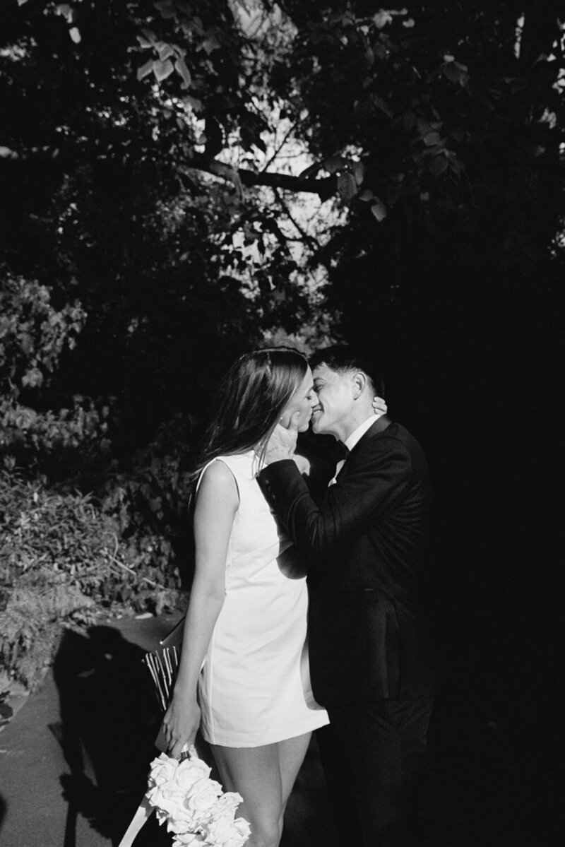 couple sharing a kiss on 35mm film