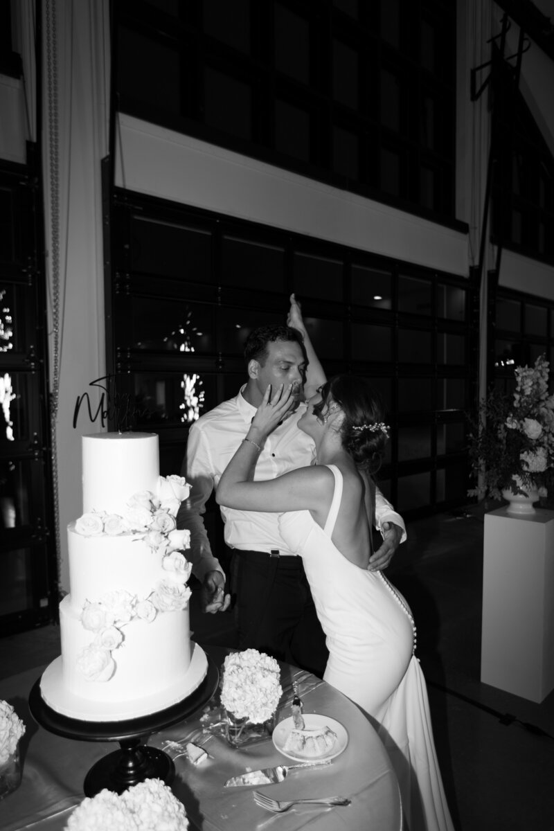wedding cake moment photographed by The Deans Photography