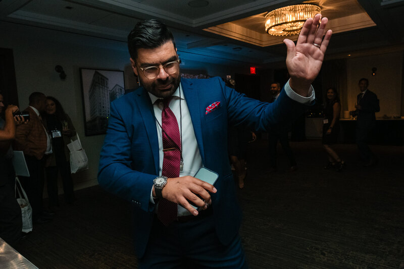 A man playing the violin during a cocktail hour reception. 