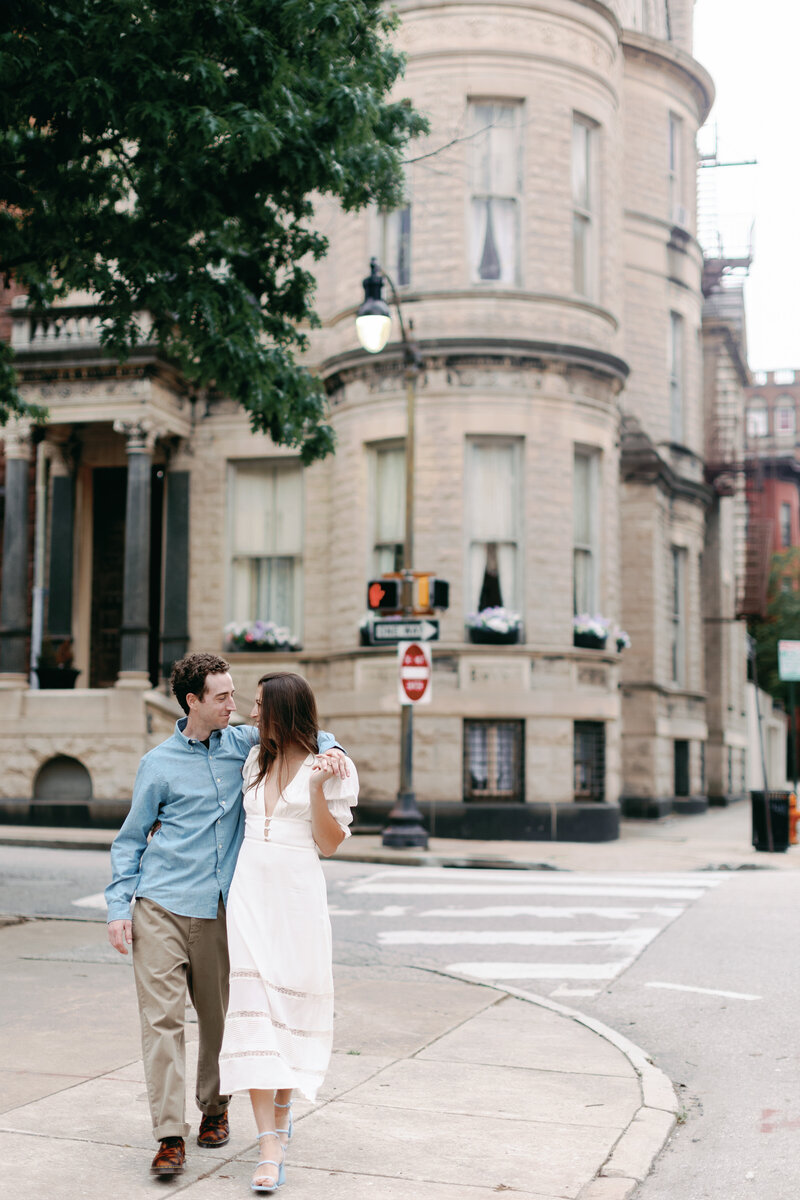 A couple shares an embrace as they walk downtown Wilmington