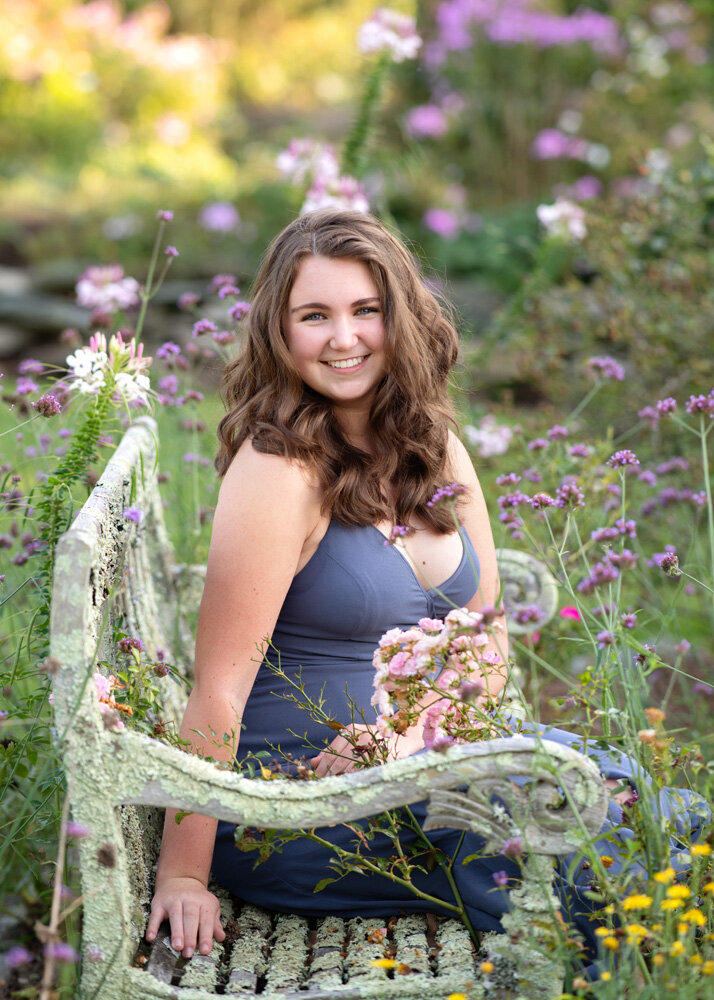 Senior session on bench with lavender flowers