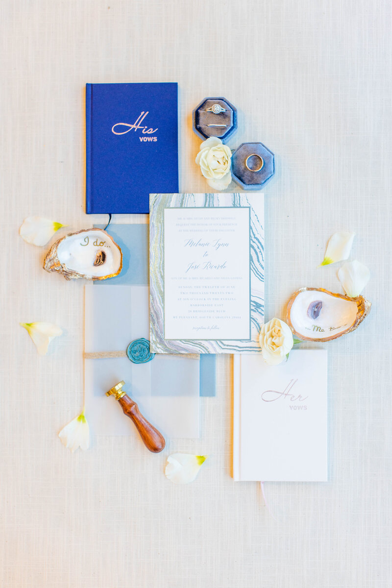flat lay details with accents of navy blue and oyster shells